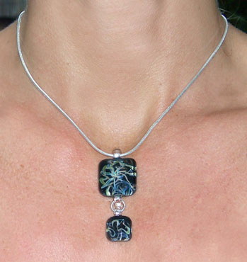Silver Diptych Square on Omega Chain
